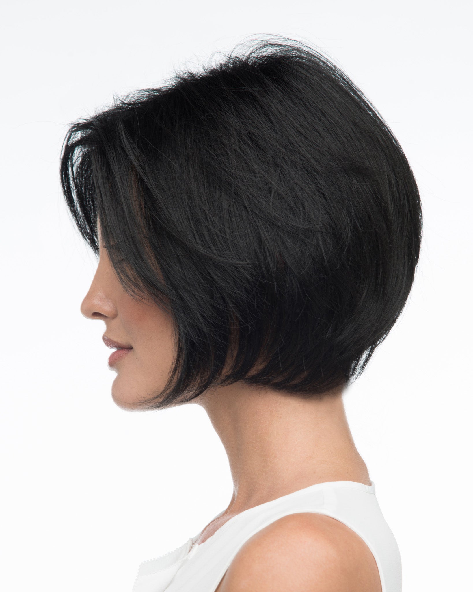 profile side of a short Kinner Beauty Wigs wig on woman head