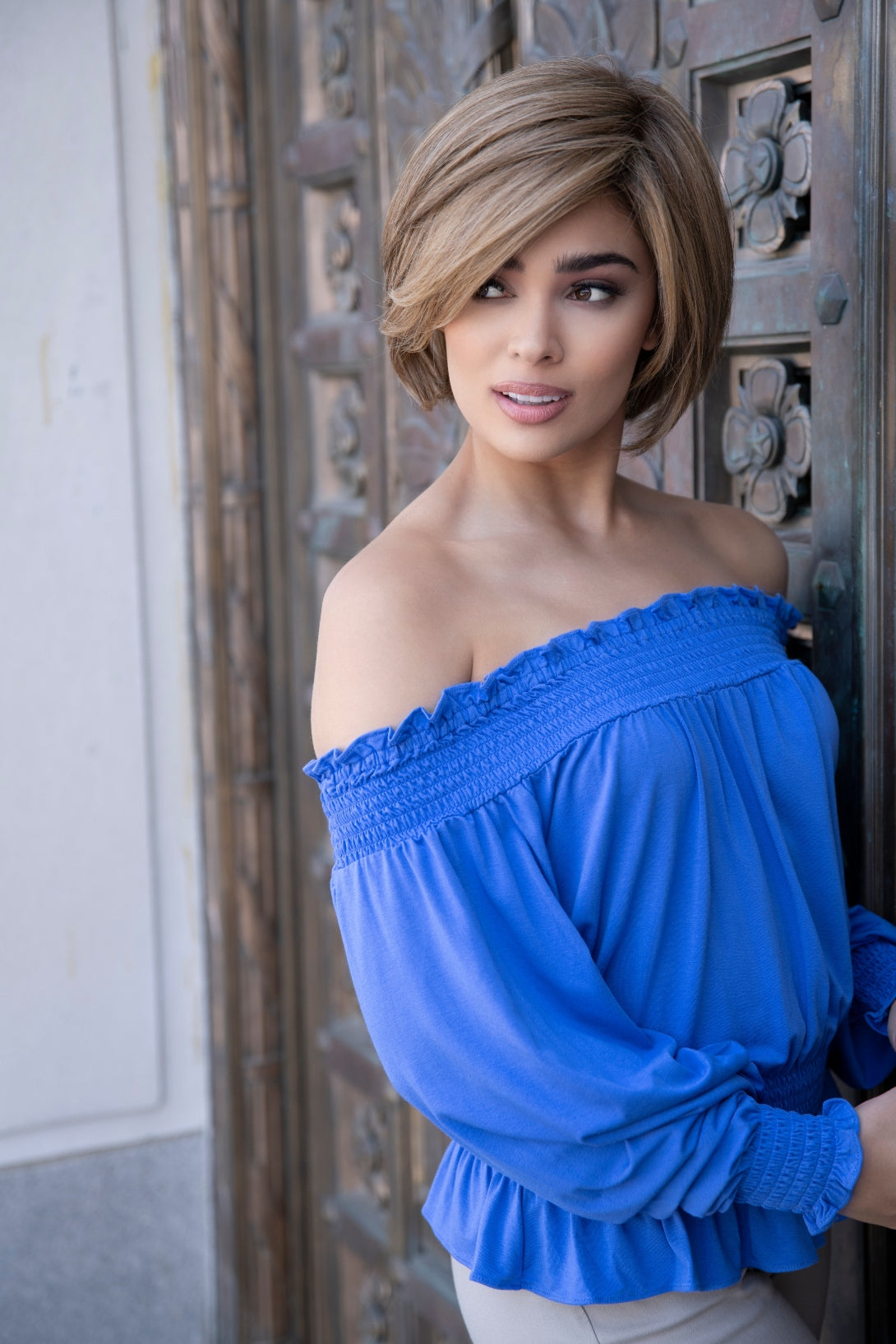 front side of a short Kinner Beauty Wigs wig on woman head