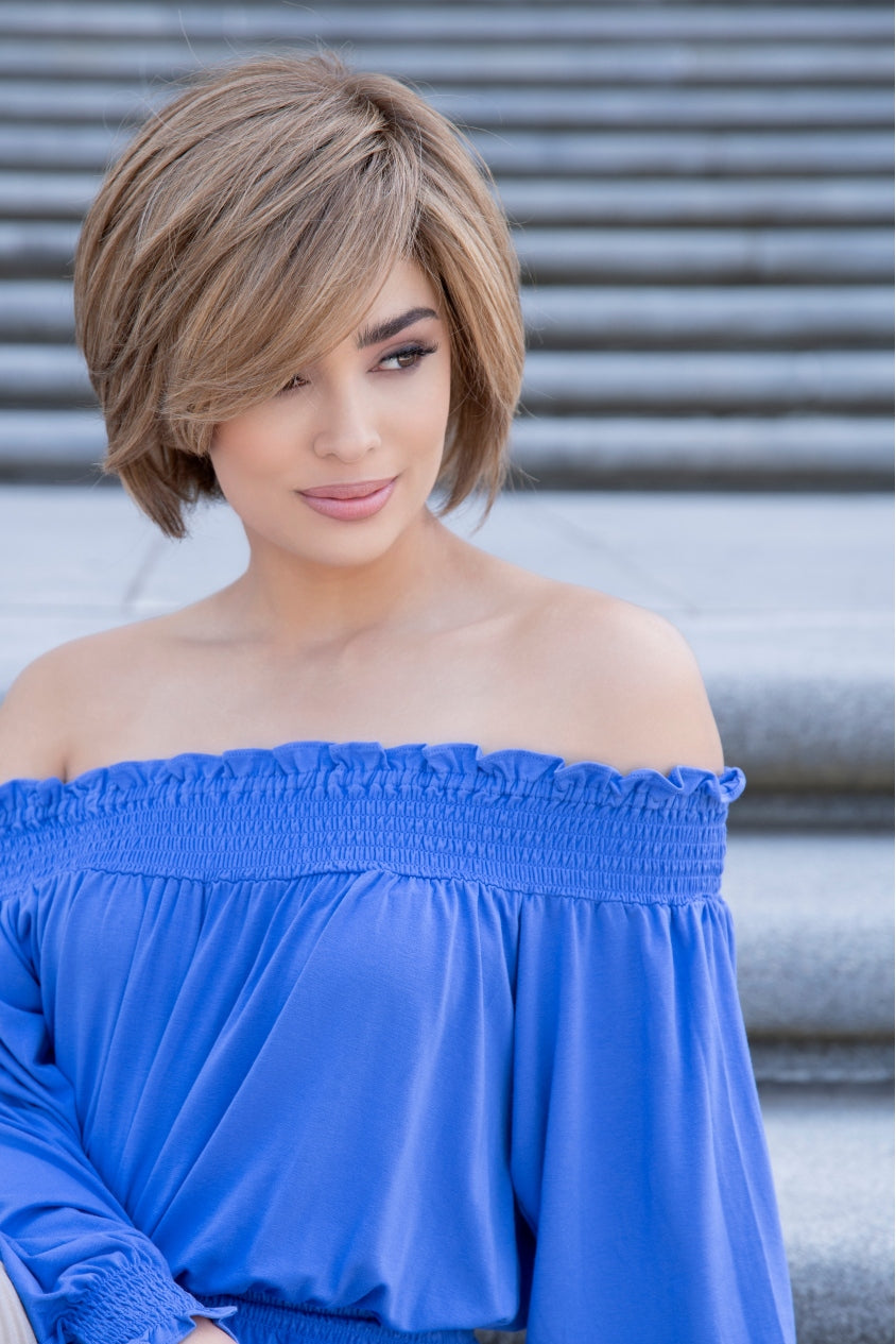 profile side of a short Kinner Beauty Wigs wig on woman head