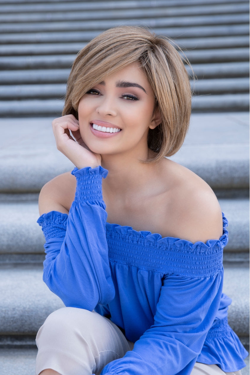 front side of a short Kinner Beauty Wigs wig on woman head
