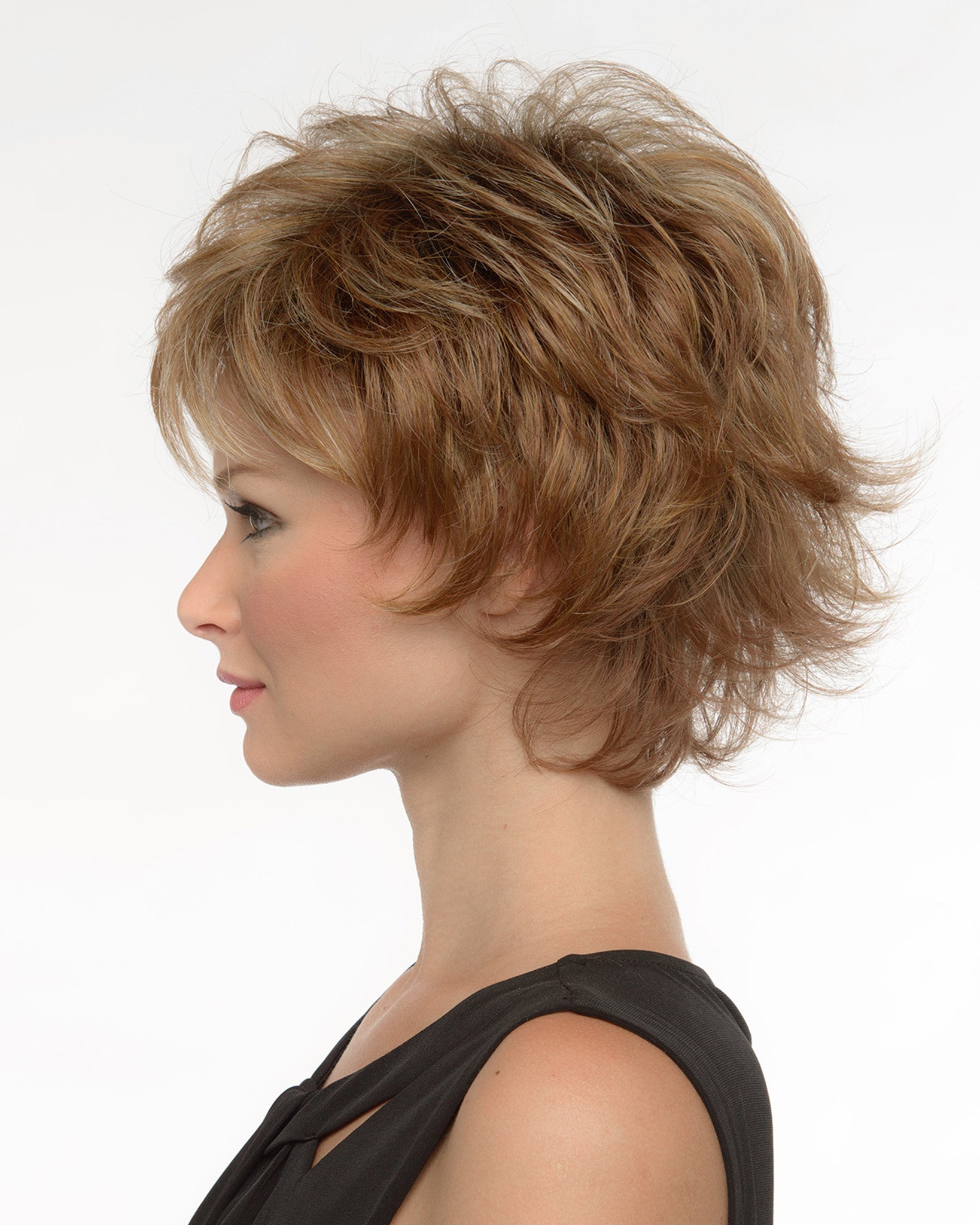 profile side of a short Kinner Beauty Wigs wig on woman head
