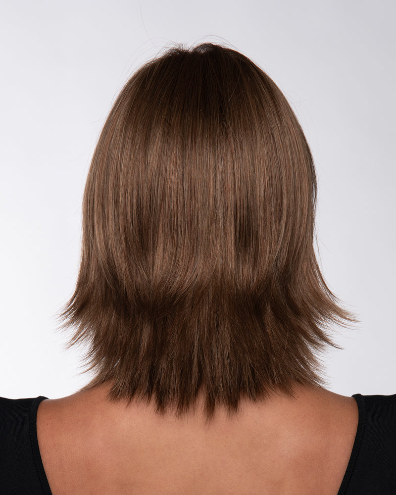 back side of a medium Kinner Beauty Wigs wig on woman head