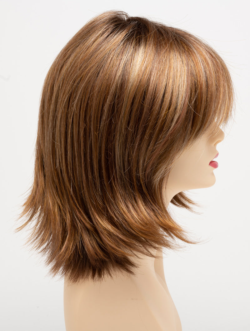 profile side of a medium Kinner Beauty Wigs wig for woman on mannequin head