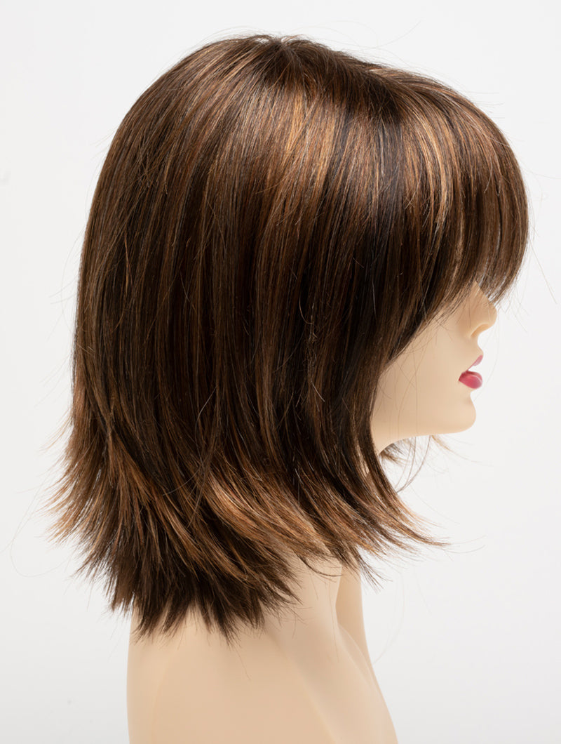 profile side of a medium Kinner Beauty Wigs wig for woman on mannequin head