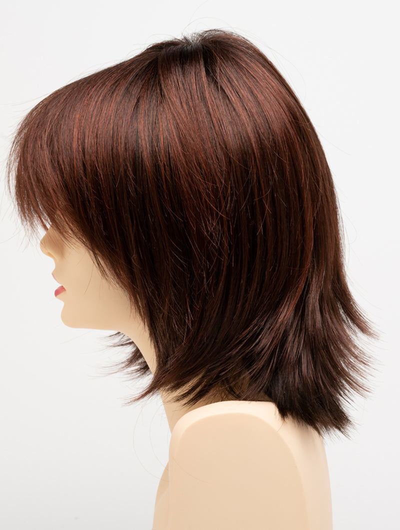 profile side of a medium Kinner Beauty Wigs wig for woman on mannequin head