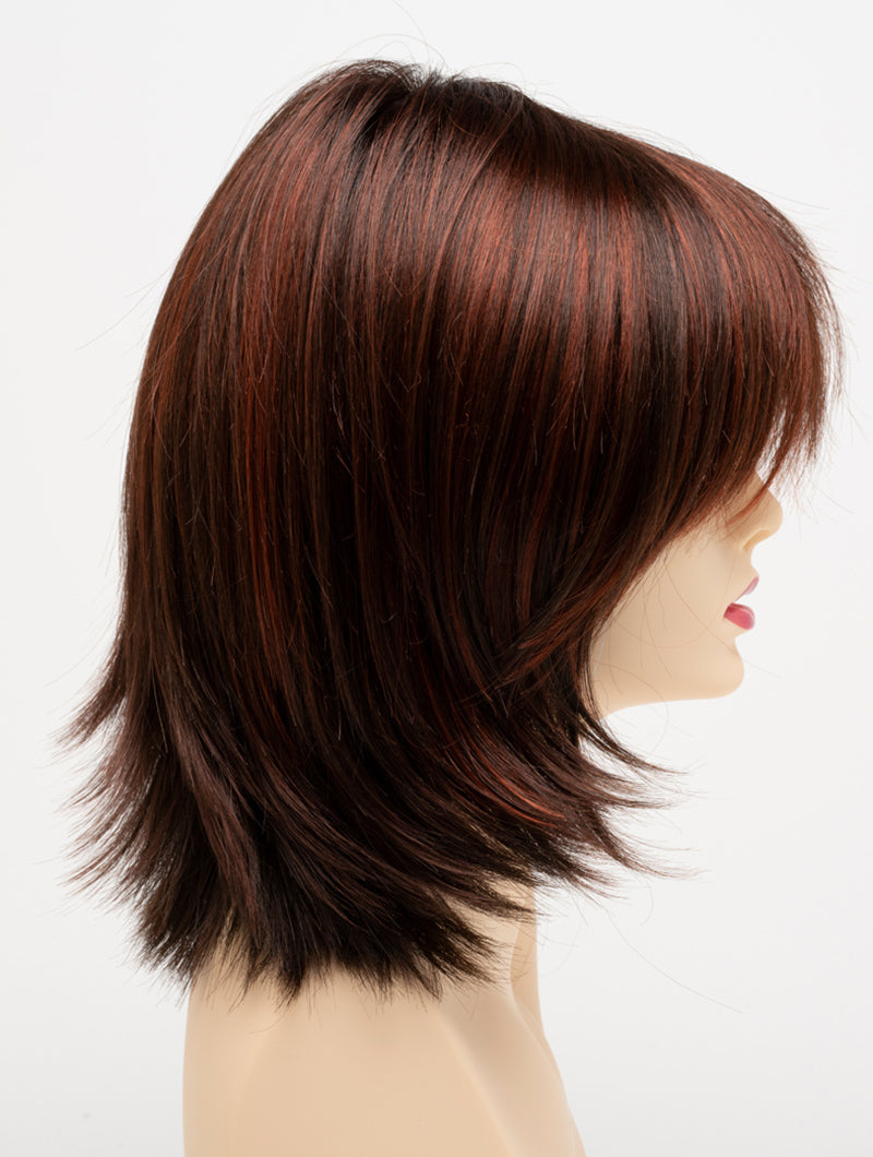 profile side of a medium Kinner Beauty Wigs wig for woman on mannequin head