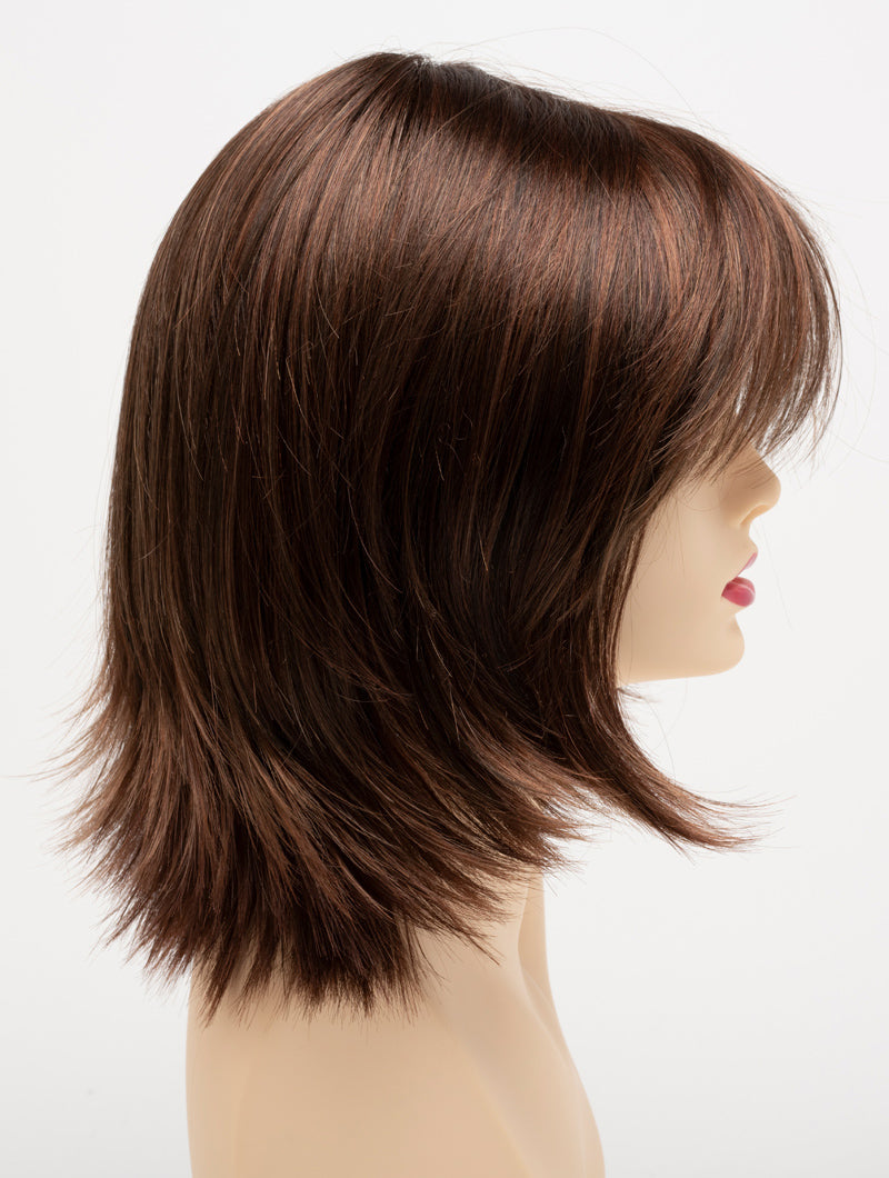 profile side of a medium Kinner Beauty Wigs wig for woman on mannequin head