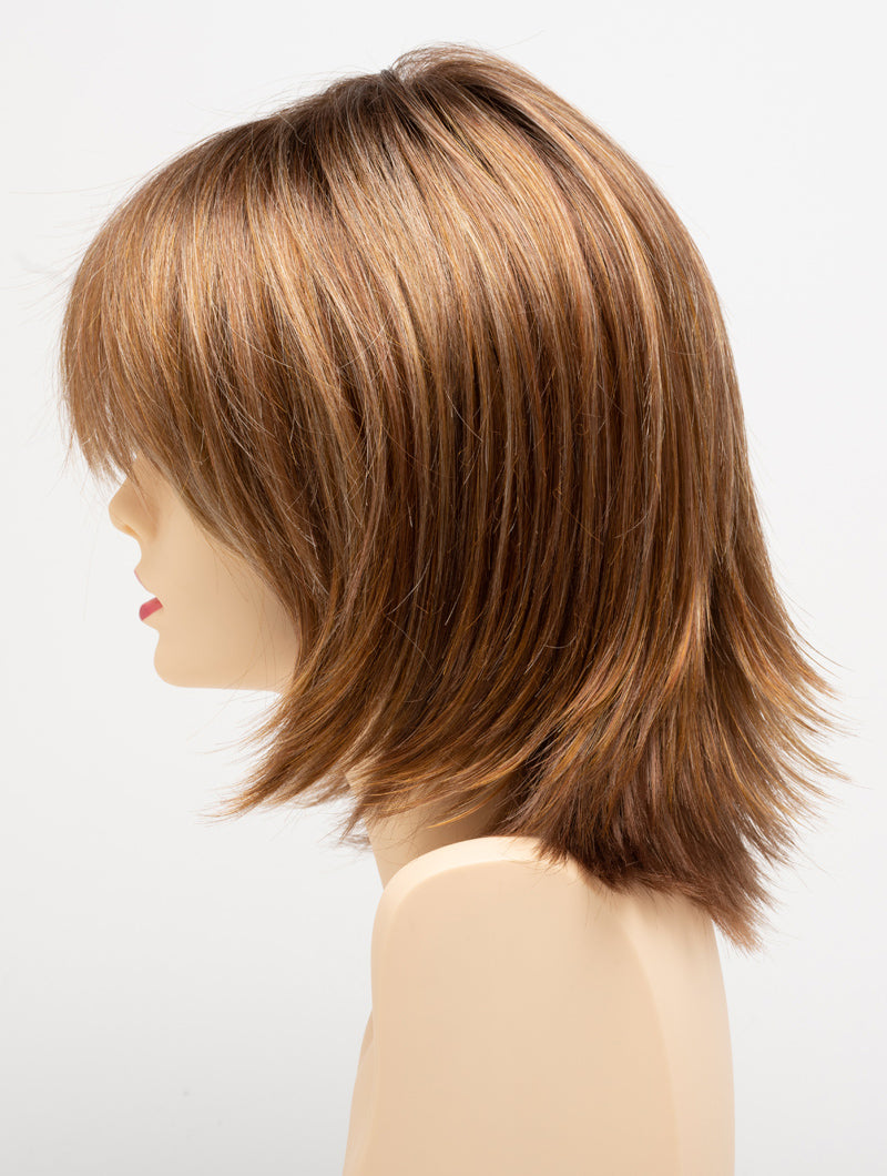 profile side of a medium Kinner Beauty Wigs wig for woman on mannequin head
