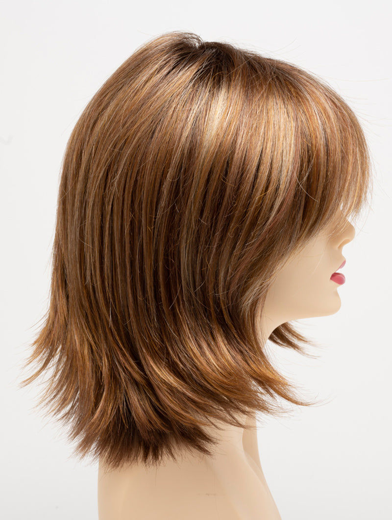 profile side of a medium Kinner Beauty Wigs wig for woman on mannequin head