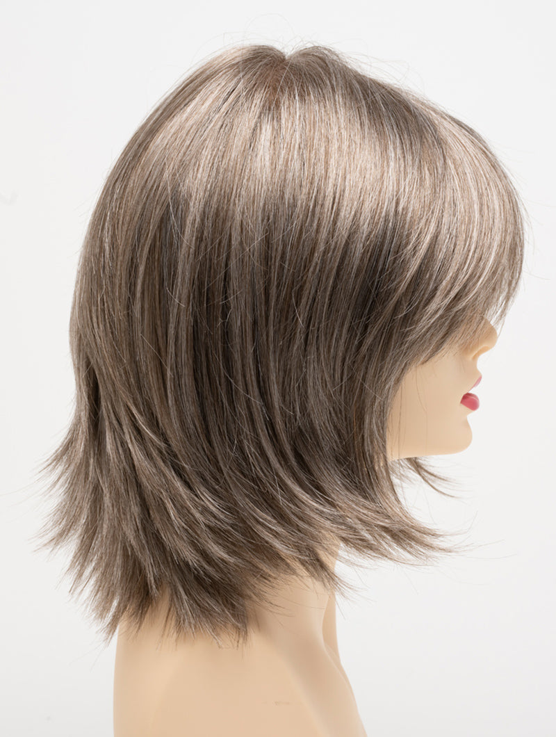 profile side of a medium Kinner Beauty Wigs wig for woman on mannequin head