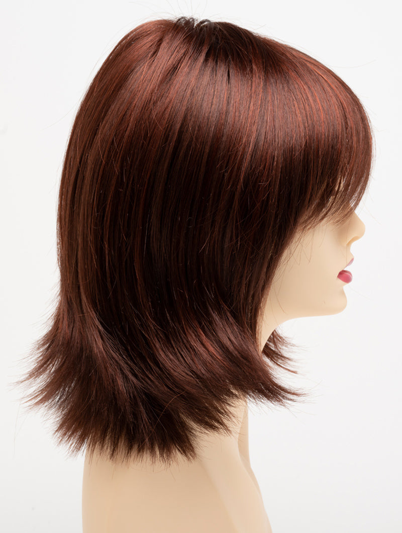 profile side of a medium Kinner Beauty Wigs wig for woman on mannequin head