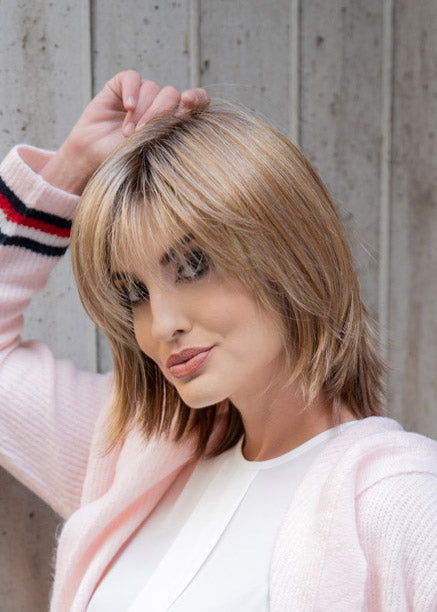 profile side of a medium Kinner Beauty Wigs wig on woman head