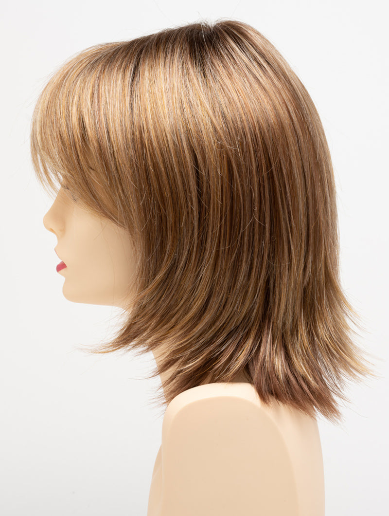 profile side of a medium Kinner Beauty Wigs wig for woman on mannequin head