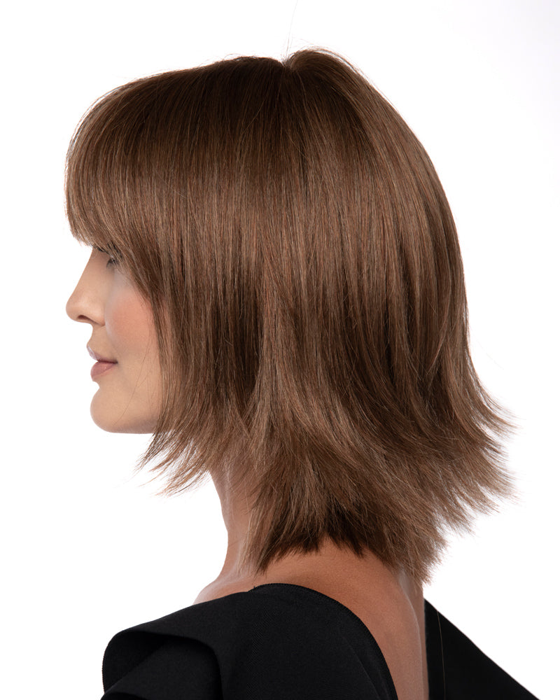 profile side of a medium Kinner Beauty Wigs wig on woman head