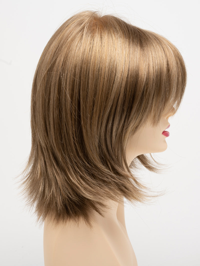 profile side of a medium Kinner Beauty Wigs wig for woman on mannequin head