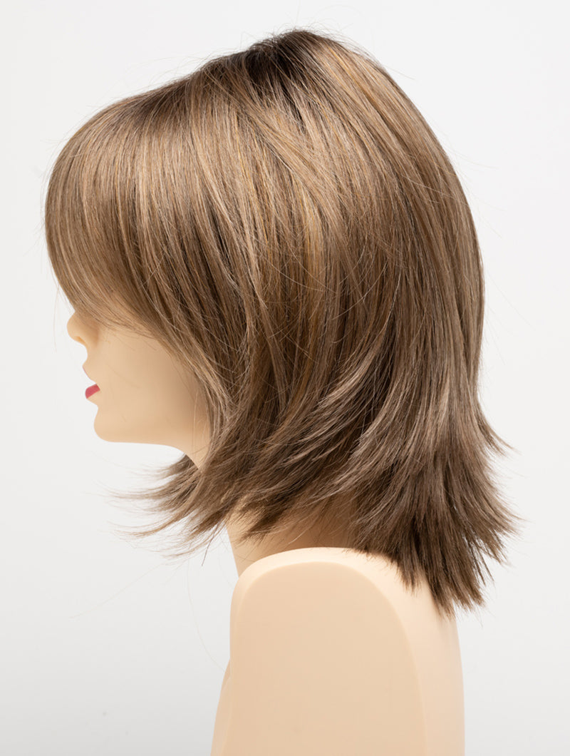 profile side of a medium Kinner Beauty Wigs wig for woman on mannequin head
