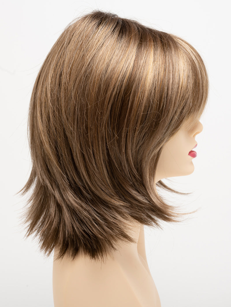 profile side of a medium Kinner Beauty Wigs wig for woman on mannequin head