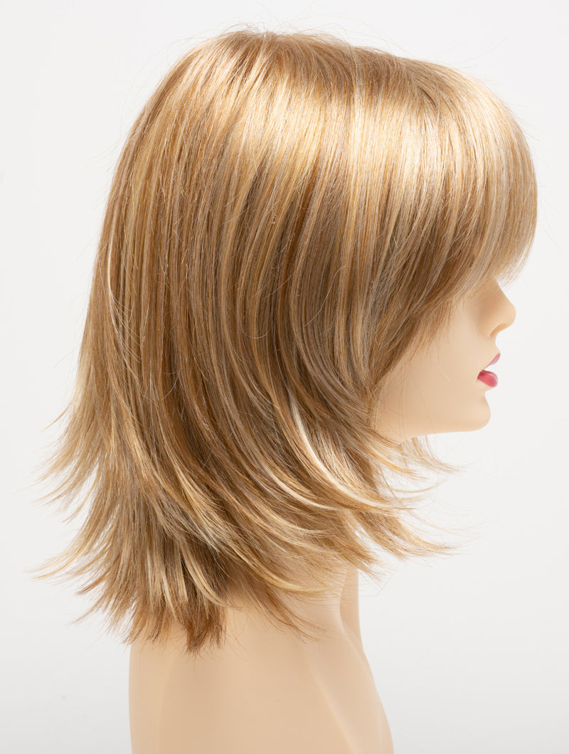 profile side of a medium Kinner Beauty Wigs wig for woman on mannequin head