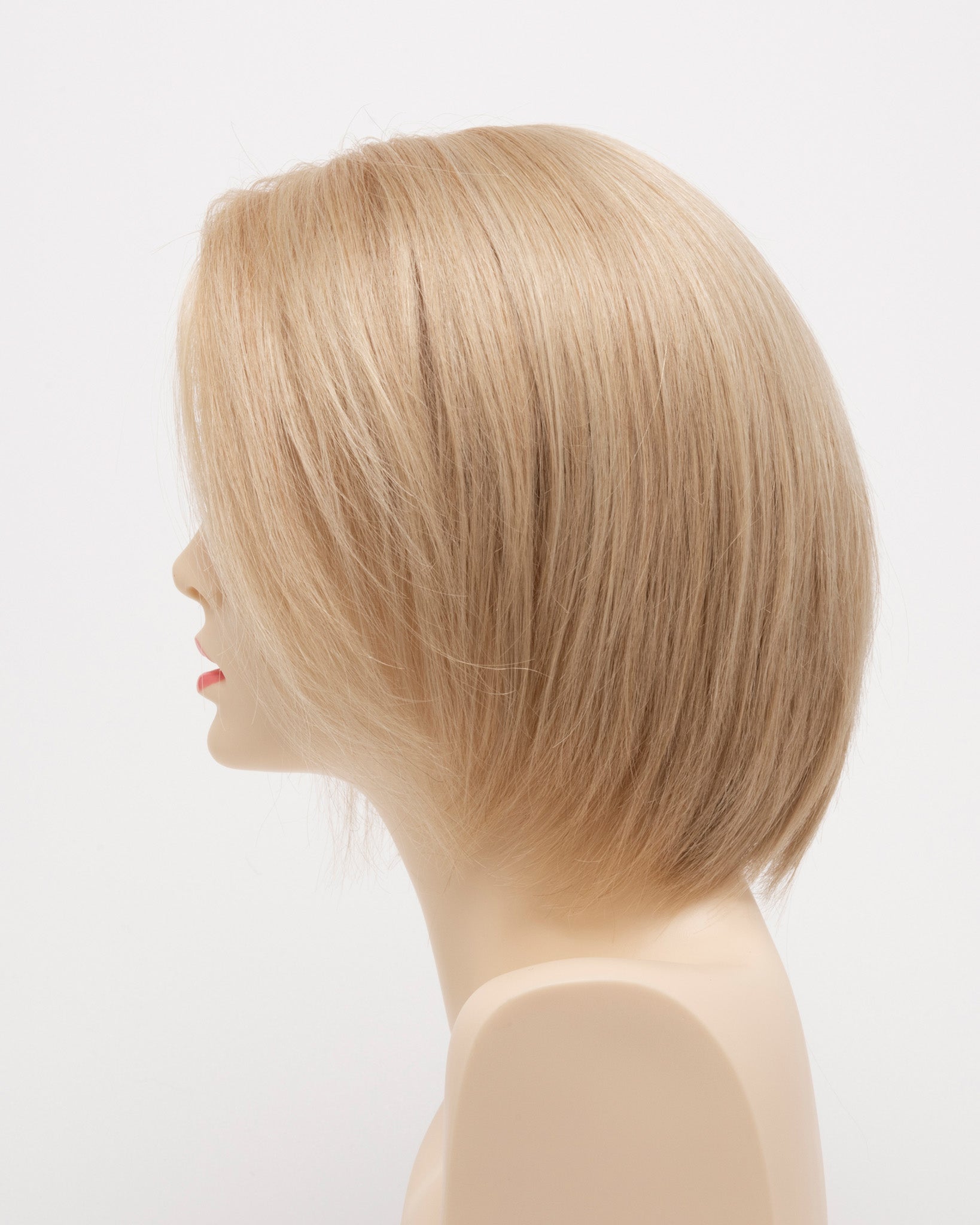 profile side of a short Kinner Beauty Wigs wig for woman on mannequin head