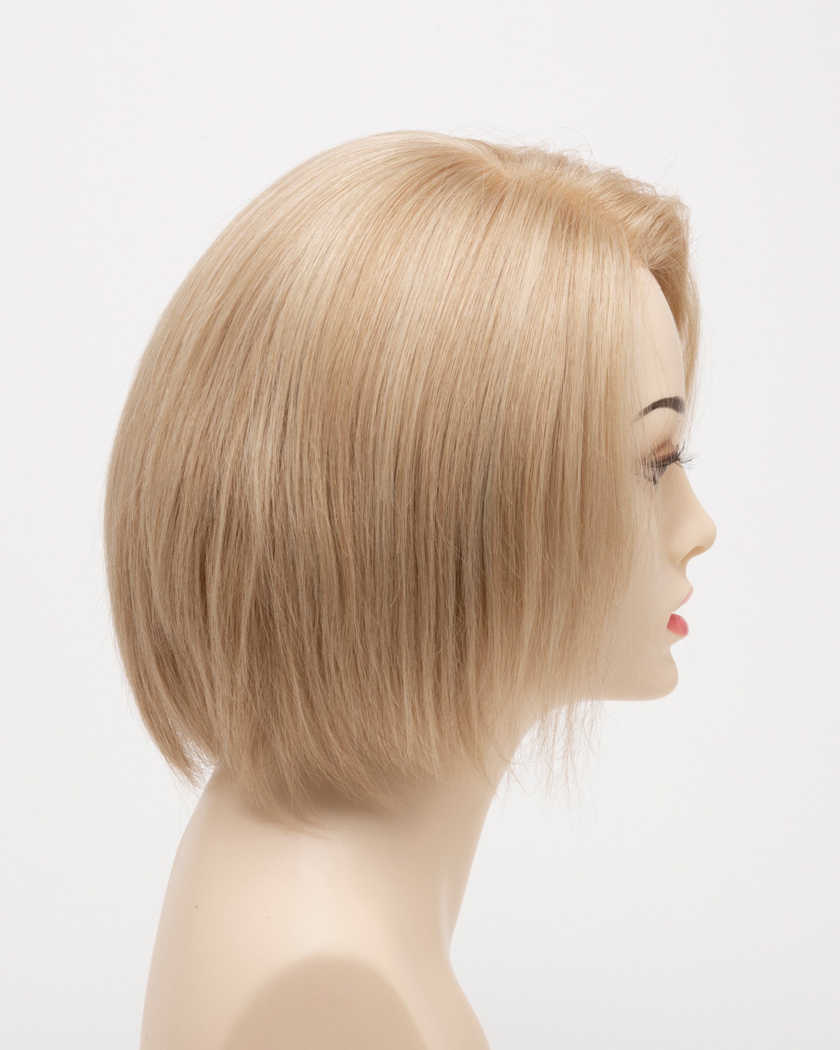 profile side of a short Kinner Beauty Wigs wig for woman on mannequin head