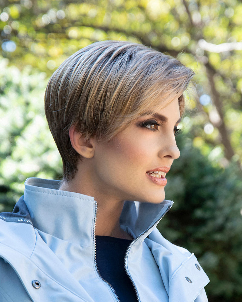profile side of a short Kinner Beauty Wigs wig on woman head