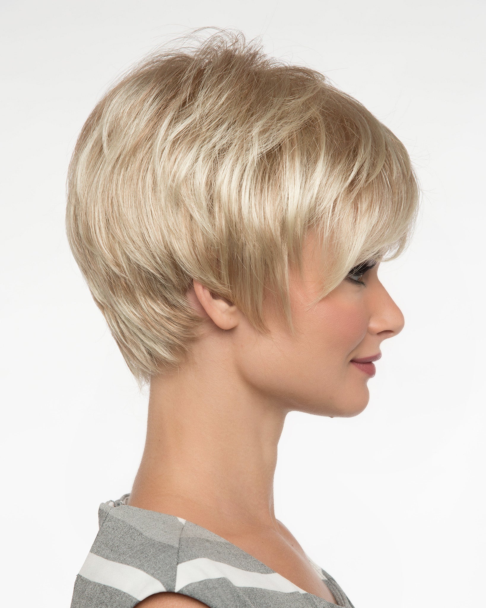 profile side of a short Kinner Beauty Wigs wig on woman head