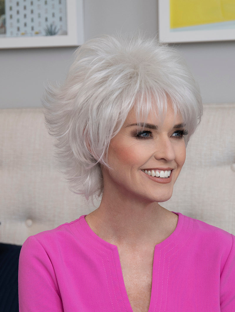 profile side of a short Kinner Beauty Wigs wig on woman head