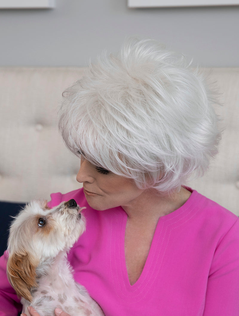 profile side of a short Kinner Beauty Wigs wig on woman head