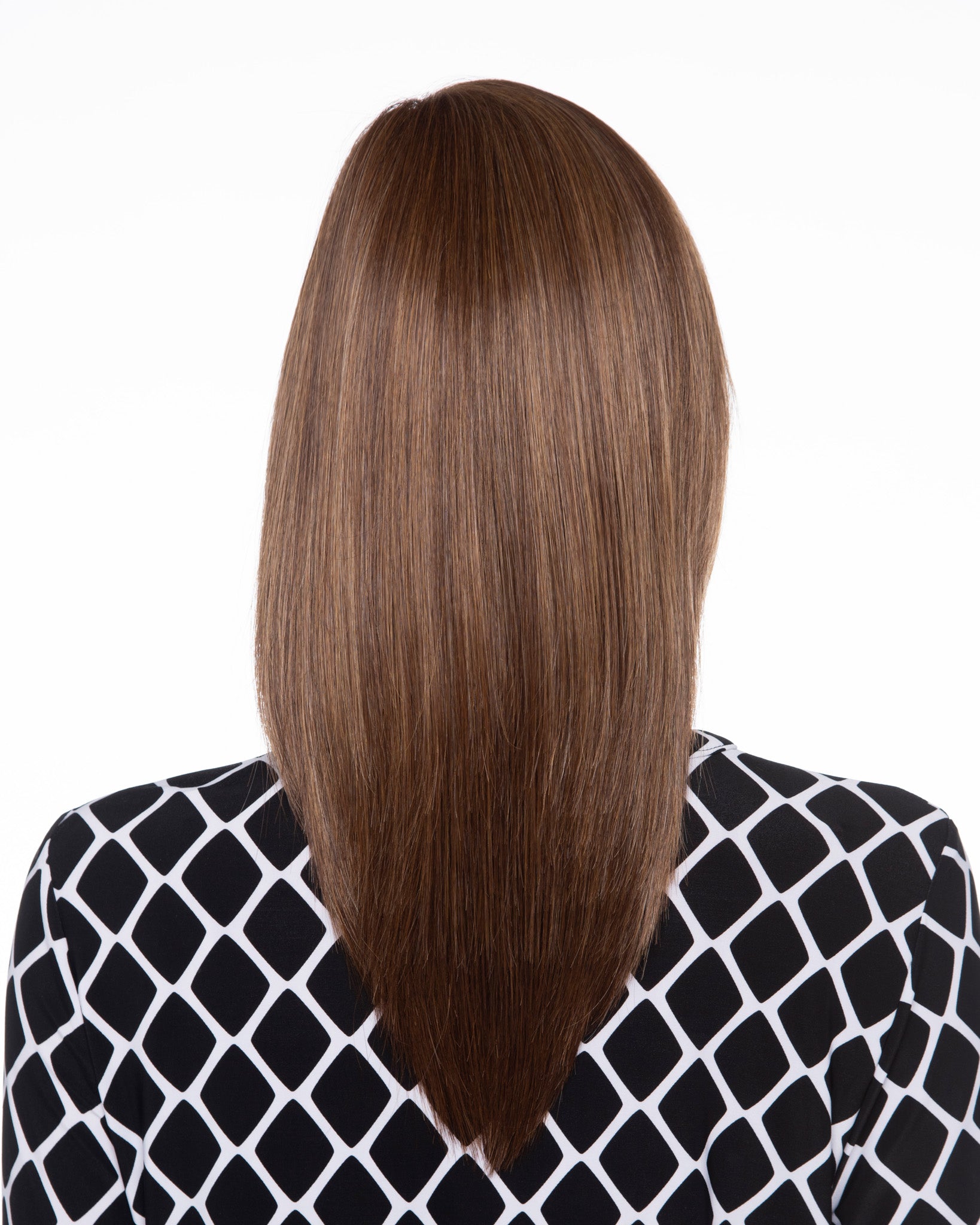 back side of a long Kinner Beauty Wigs wig on woman head