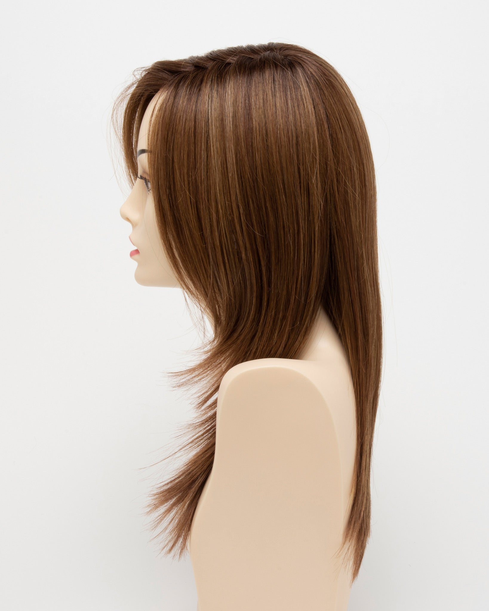 profile side of a long Kinner Beauty Wigs wig for woman on mannequin head