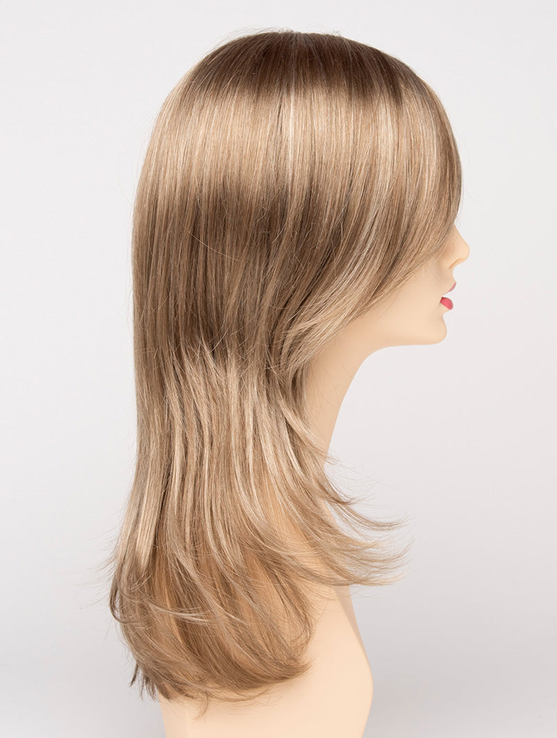 profile side of a long Kinner Beauty Wigs wig for woman on mannequin head