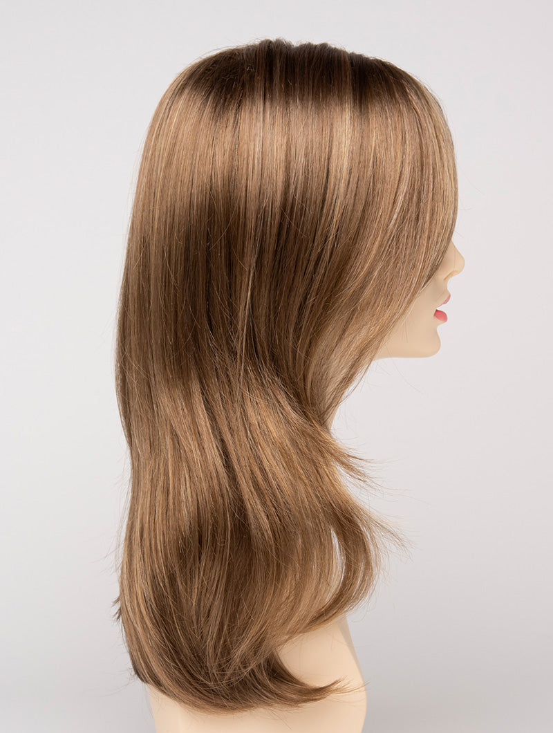 profile side of a long Kinner Beauty Wigs wig for woman on mannequin head