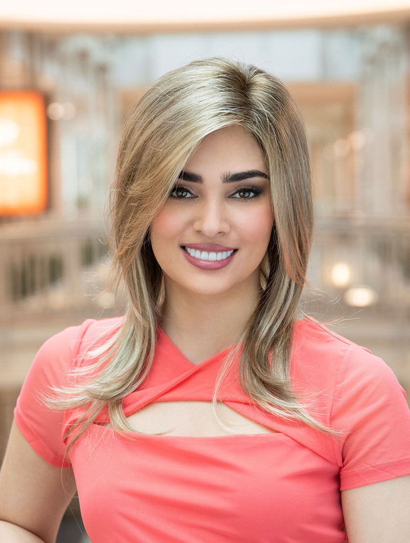 front side of a long Kinner Beauty Wigs wig on woman head