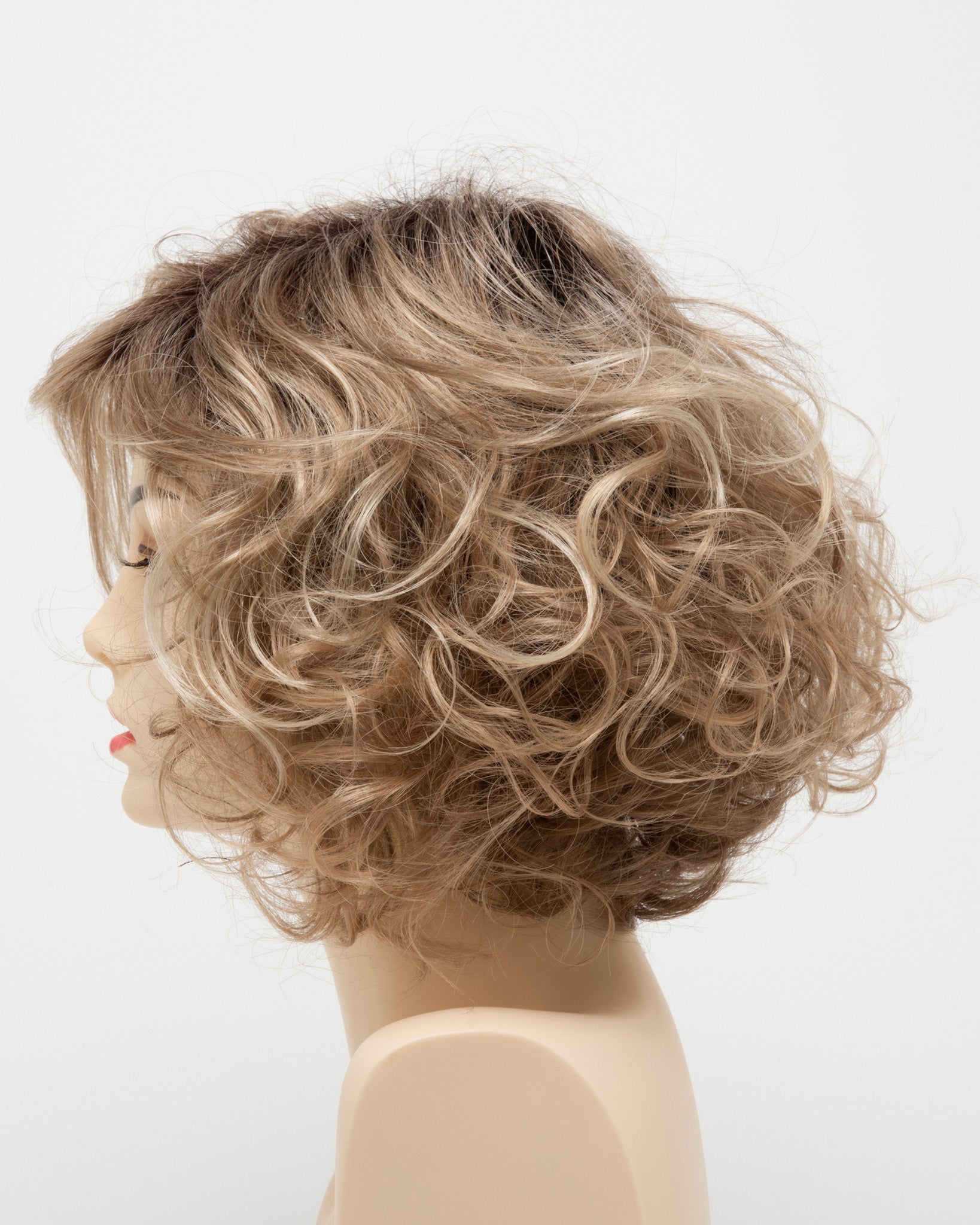 profile side of a medium Kinner Beauty Wigs wig for woman on mannequin head
