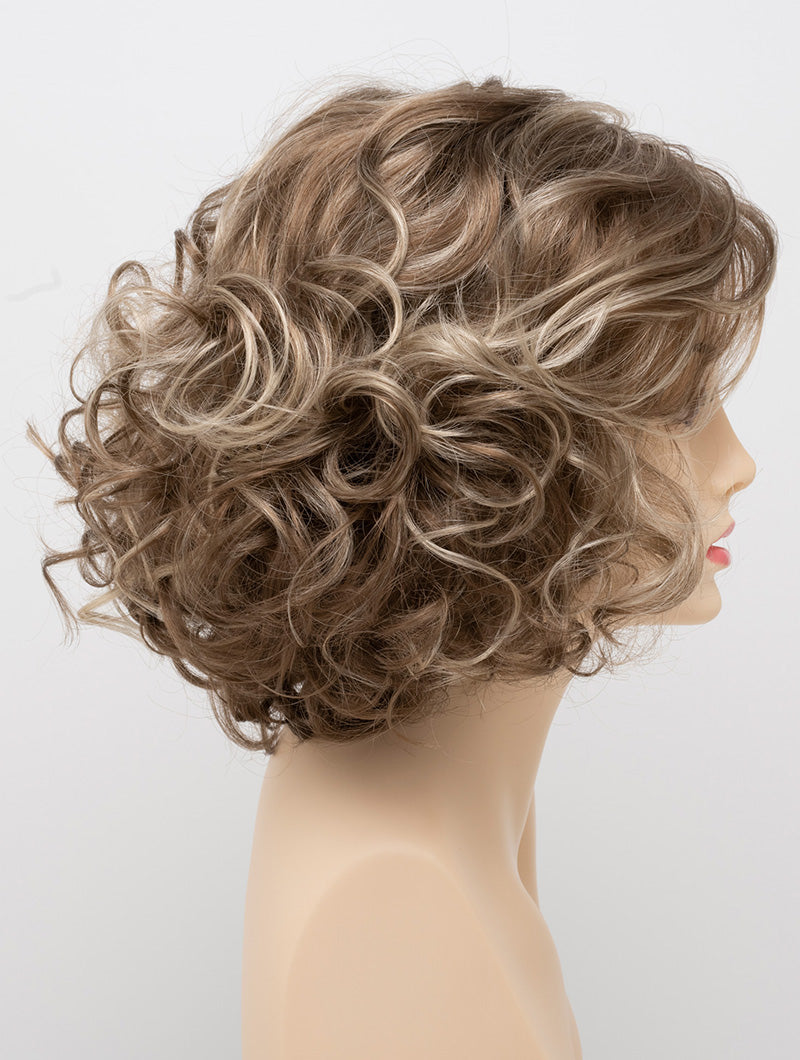 profile side of a medium Kinner Beauty Wigs wig for woman on mannequin head