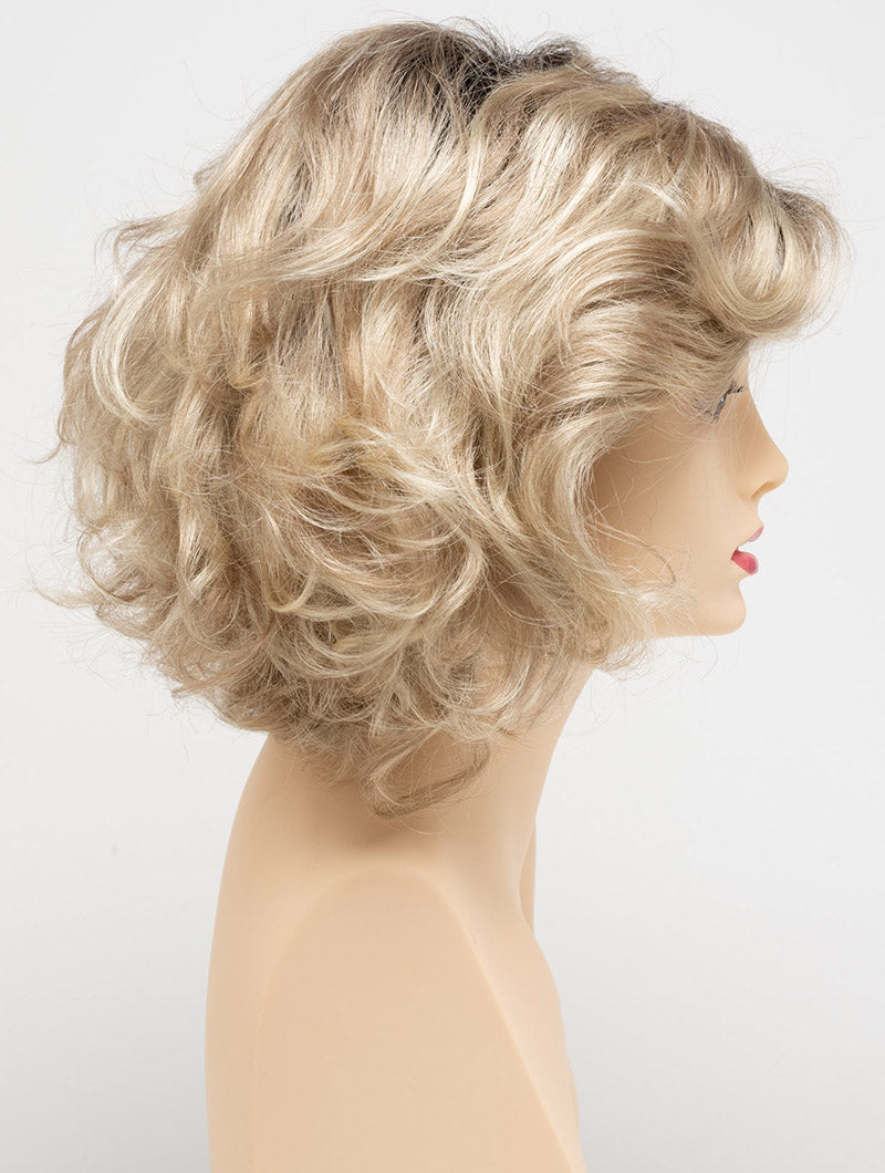 profile side of a medium Kinner Beauty Wigs wig for woman on mannequin head