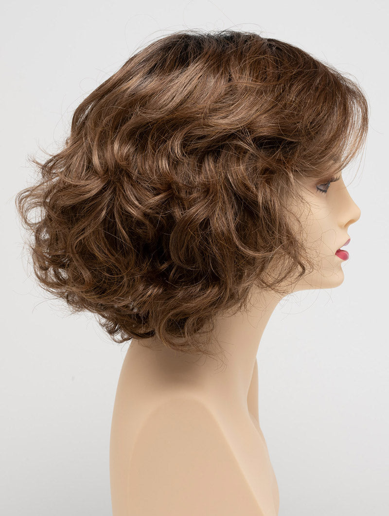 profile side of a medium Kinner Beauty Wigs wig for woman on mannequin head