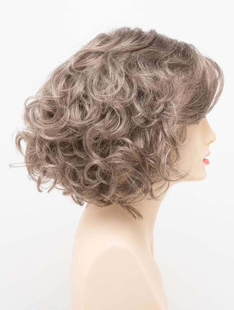 profile side of a medium Kinner Beauty Wigs wig for woman on mannequin head