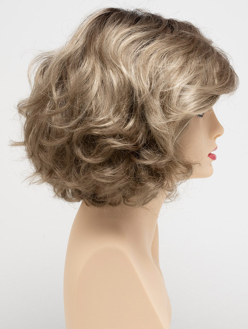 profile side of a medium Kinner Beauty Wigs wig for woman on mannequin head
