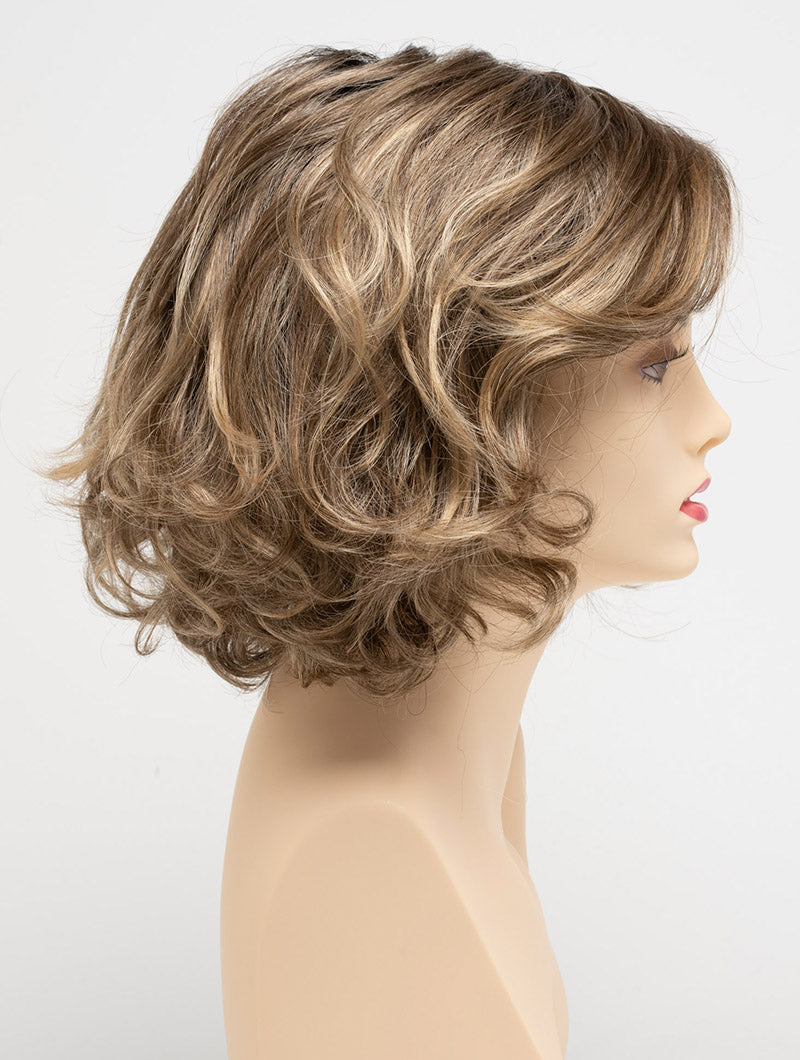profile side of a medium Kinner Beauty Wigs wig for woman on mannequin head