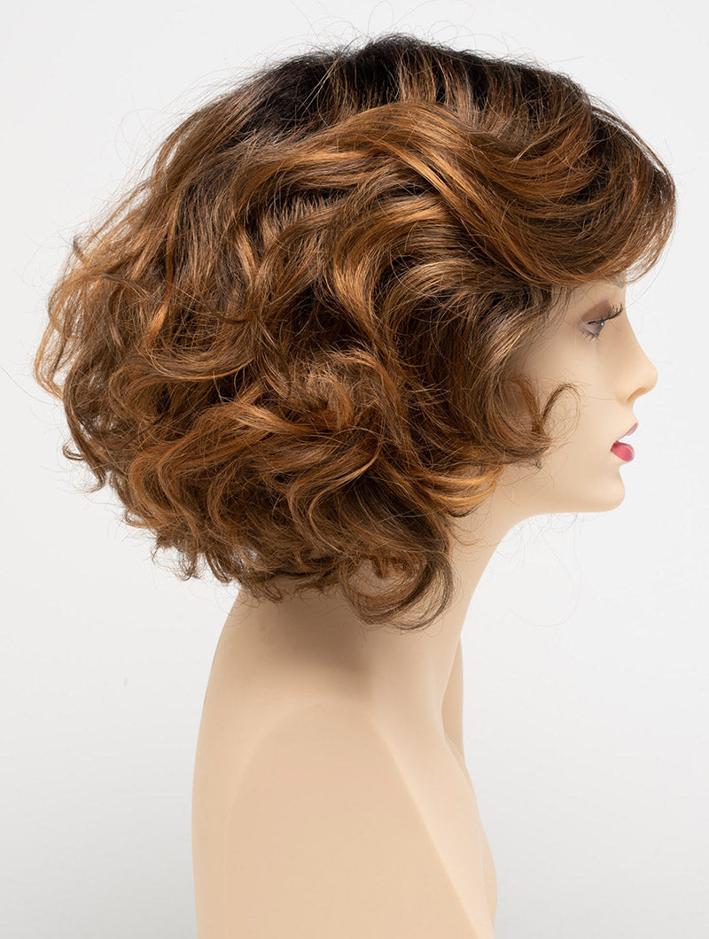 profile side of a medium Kinner Beauty Wigs wig for woman on mannequin head