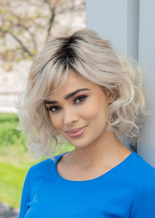 front side of a medium Kinner Beauty Wigs wig on woman head