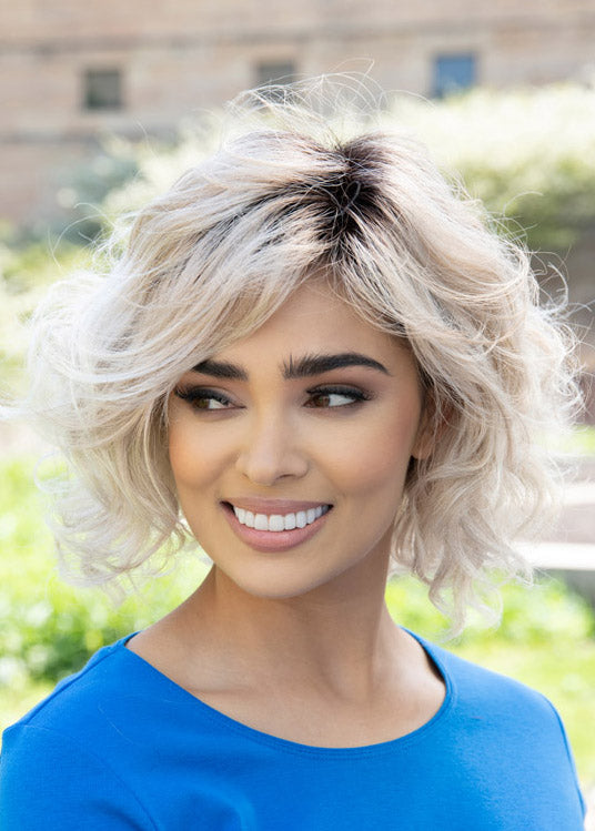 front side of a medium Kinner Beauty Wigs wig on woman head