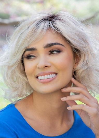 front side of a medium Kinner Beauty Wigs wig on woman head