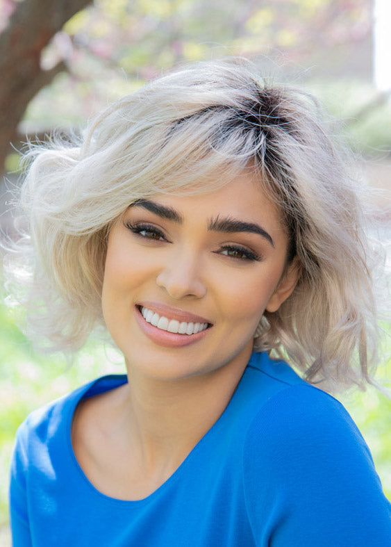 front side of a medium Kinner Beauty Wigs wig on woman head
