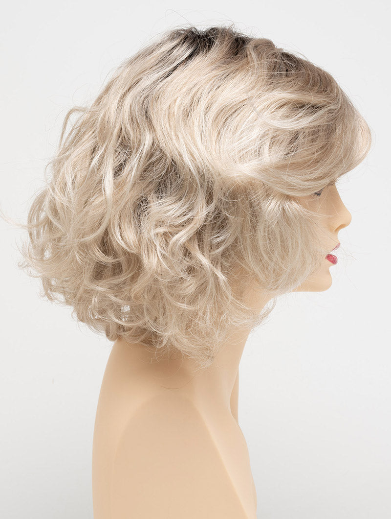 profile side of a medium Kinner Beauty Wigs wig for woman on mannequin head