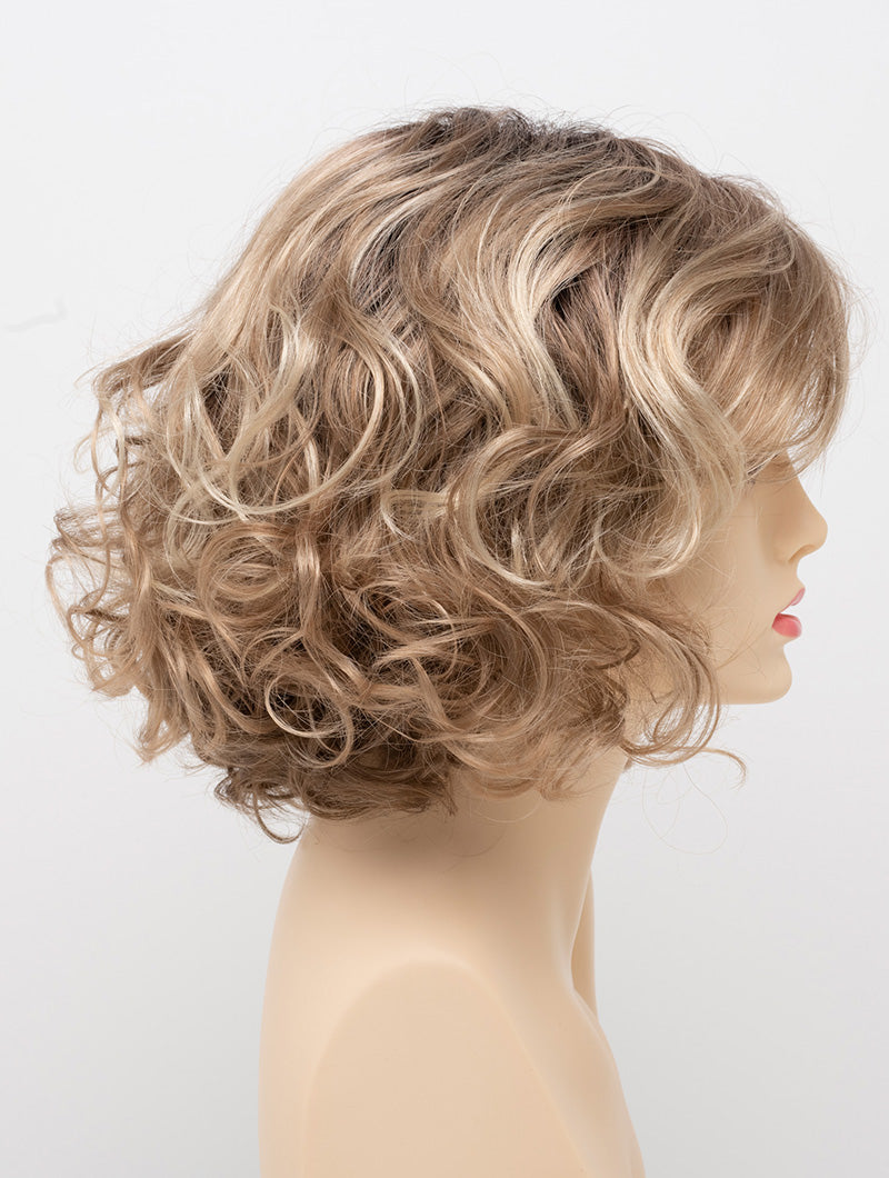 profile side of a medium Kinner Beauty Wigs wig for woman on mannequin head