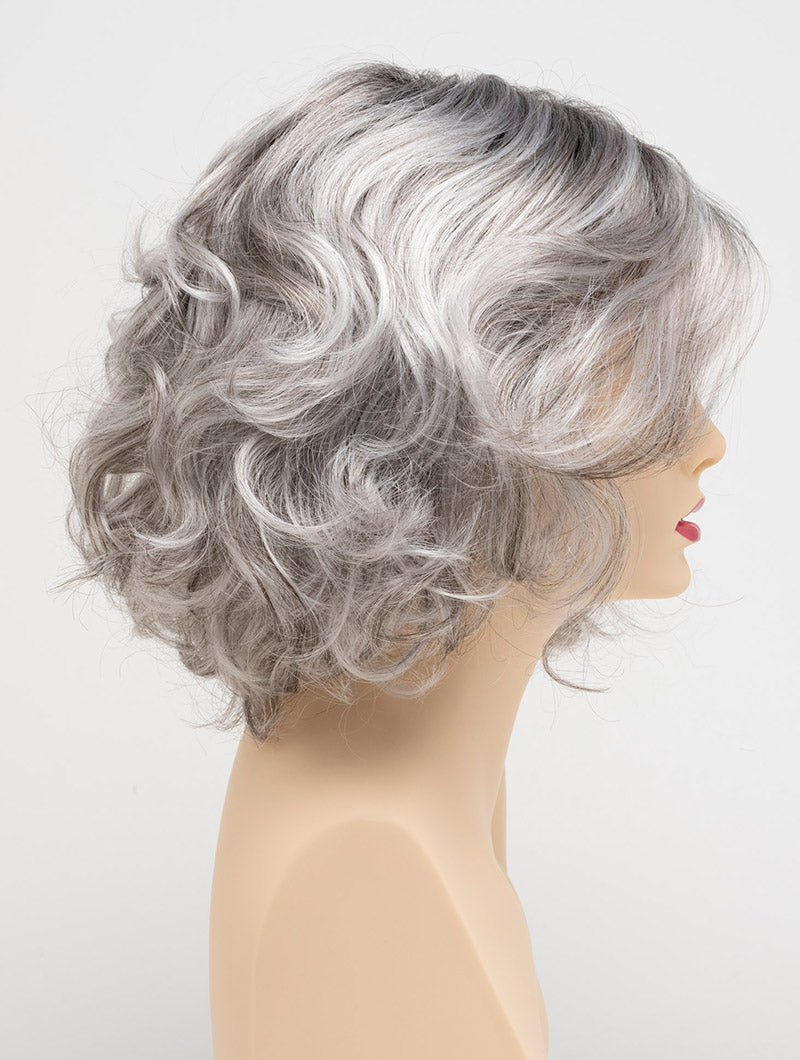 profile side of a medium Kinner Beauty Wigs wig for woman on mannequin head