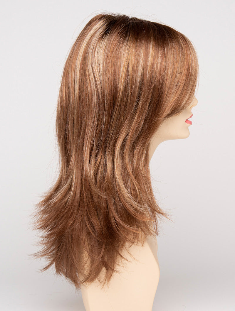 profile side of a long Kinner Beauty Wigs wig for woman on mannequin head