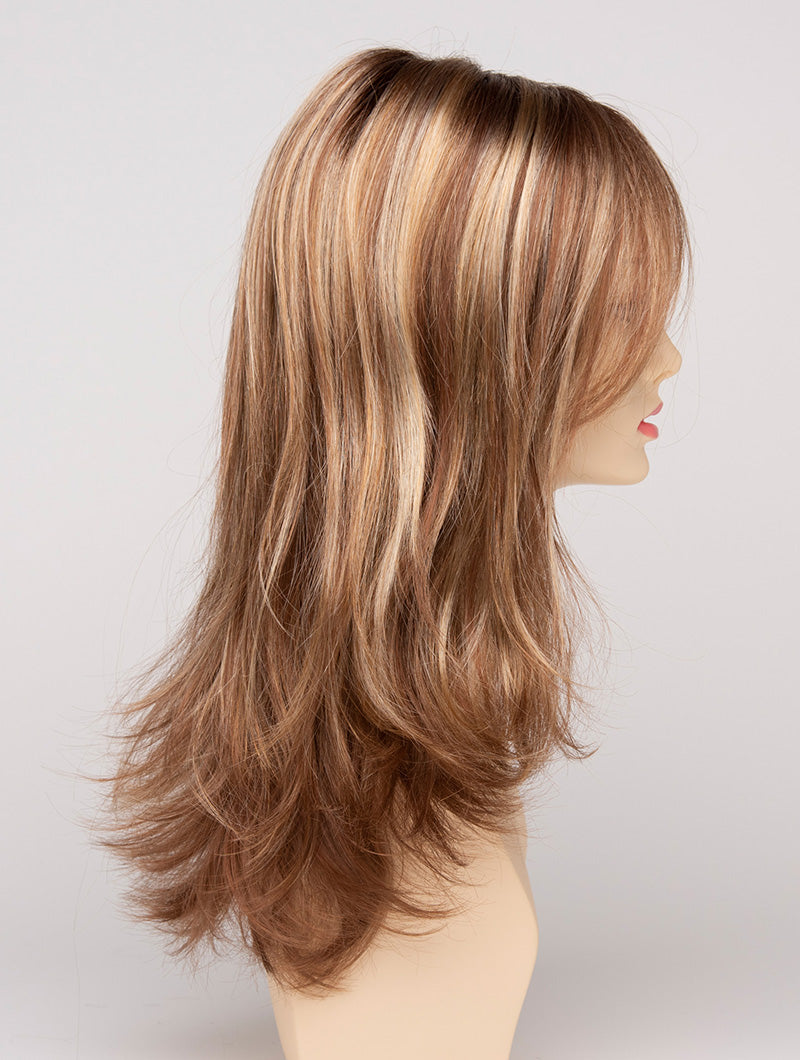 profile side of a long Kinner Beauty Wigs wig for woman on mannequin head